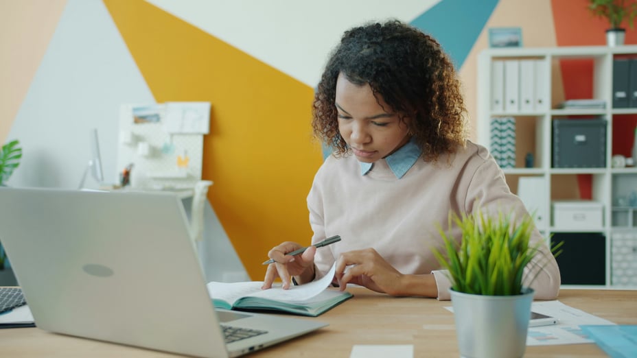 woman taking notes